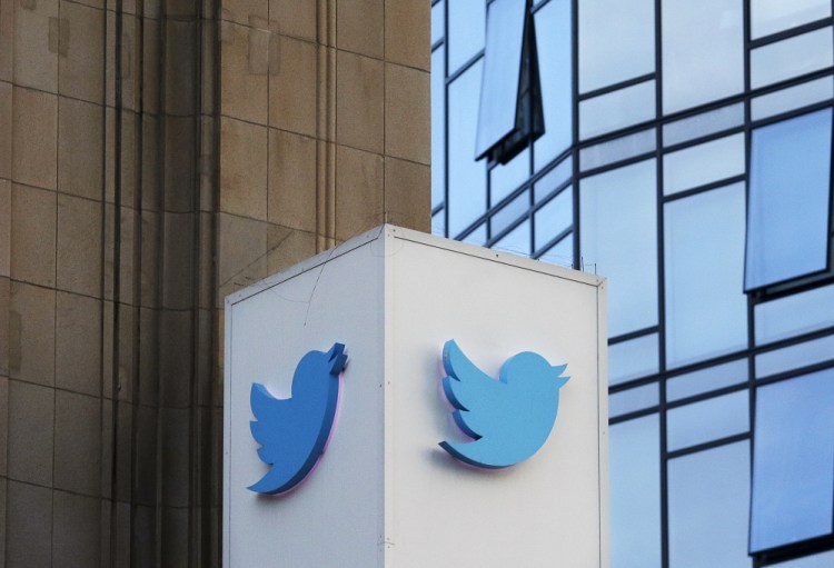 A Twitter sign standing outside of the company's headquarters in San Francisco. Twitter will be enforcing stricter policies on violent and abusive content such as hateful images or symbols, including those attached to user profiles, the company announced Monday.