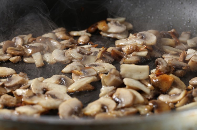 Once you add the 'shrooms to the pan, don't touch them until they begin to brown. Photos by Abel Uribe/Tribune News Service