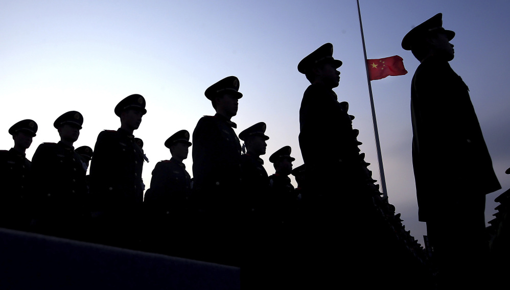 Chinese paramilitary police stand at attention during a ceremony earlier this month. U.S. officials are growing concerned about China's growth in military spending.
