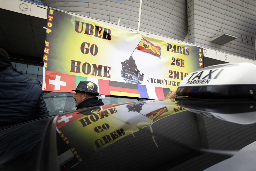 Taxi drivers demonstrate in Paris in 2016. Cab drivers in Barcelona honked their horns in victory Wednesday after the EU's top court ruled Uber can be regulated like a taxi company.