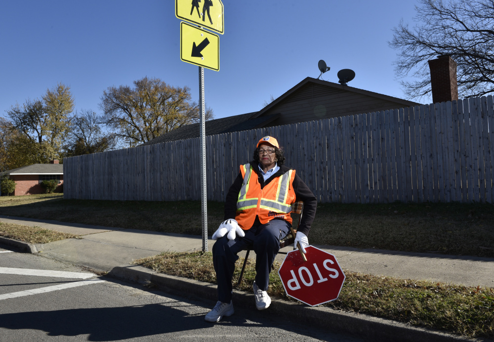 Former McDonnell-Douglas employee Ruby Oakley, 74, works as a crossing guard in Tulsa, Okla. Another worker stranded after the airplane maker closed its Tulsa plant became a barber, saying, "Thank God I had a couple of clippers." Now a federal report warns a retirement crisis could be looming, as many older Americans have to work in order to keep afloat.