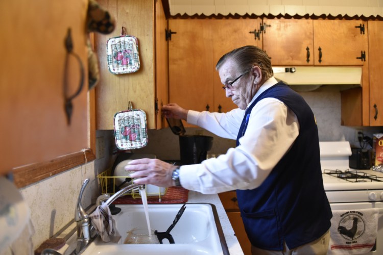 Former McDonnell-Douglas worker Tom Coomer, 79, makes coffee at home in Wagoner, Okla., after his workday at Walmart.