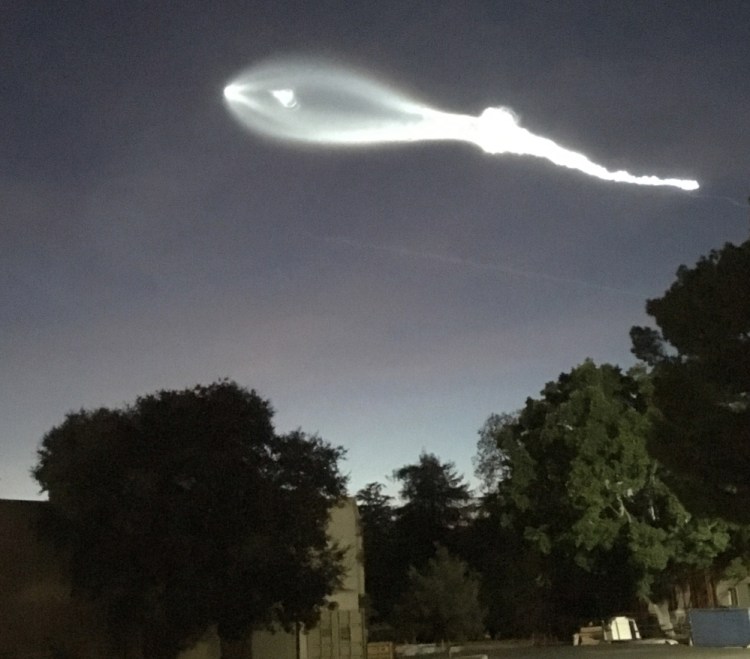 The contrail from a SpaceX Falcon 9 rocket is seen from Burbank, Calif., more than 100 miles southeast of its launch site at Vandenberg Air Force Base on Friday evening.