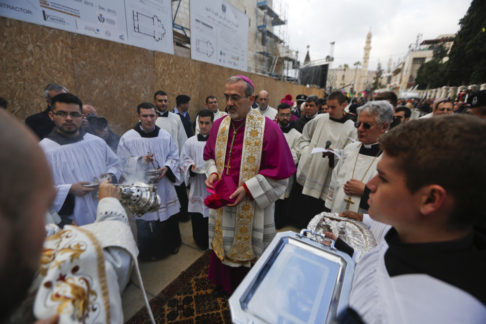 The Latin Patriarch of Jerusalem Pierbattista Pizzaballa arrives Sunday at the Church of the Nativity, built atop the site where Christians believe Jesus Christ was born in the West Bank city of Bethlehem.