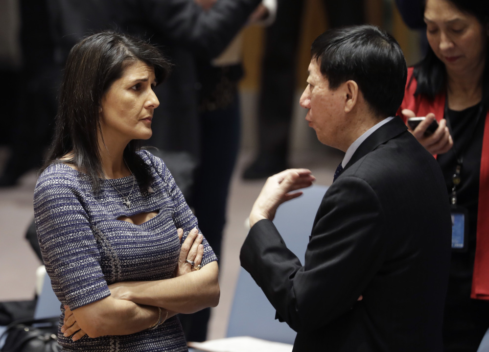U.S. Ambassador to the United Nations Nikki Haley talks with Chinese deputy ambassador Wu Haitao on Friday at United Nations headquarters. The council was voting on proposed new sanctions against North Korea, including sharply lower limits on its refined oil imports, the return home of all North Koreans working overseas, and a crackdown on the country's shipping.