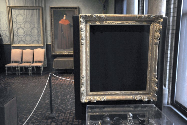 Empty frames mark where Rembrandt's "Christ in the Storm on the Sea of Galilee", left, and Vermeer's "The Concert" were stolen from Boston's Isabella Stewart Gardner Museum.