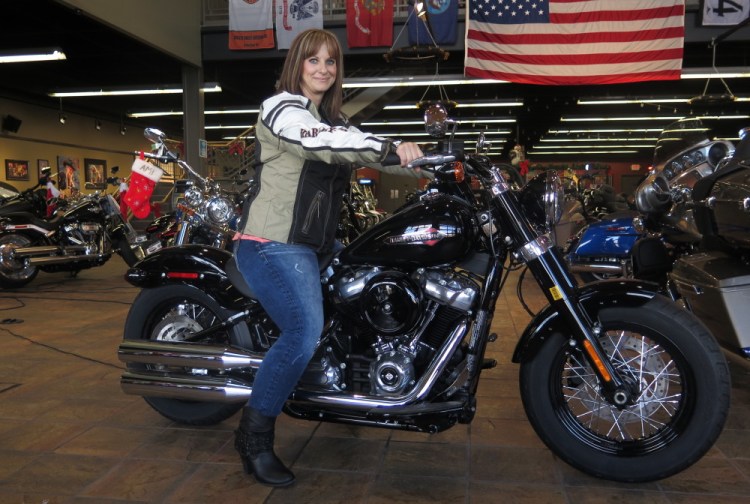 Terri Meehan, 42, with a 2018 Harley-Davidson Softail Slim at a House of Harley store in Milwaukee, Wis. Meehan took a riding course this fall through the company's Riding Academy. The motorcycle giant is working to expand the ranks of female riders from the current 14 percent.