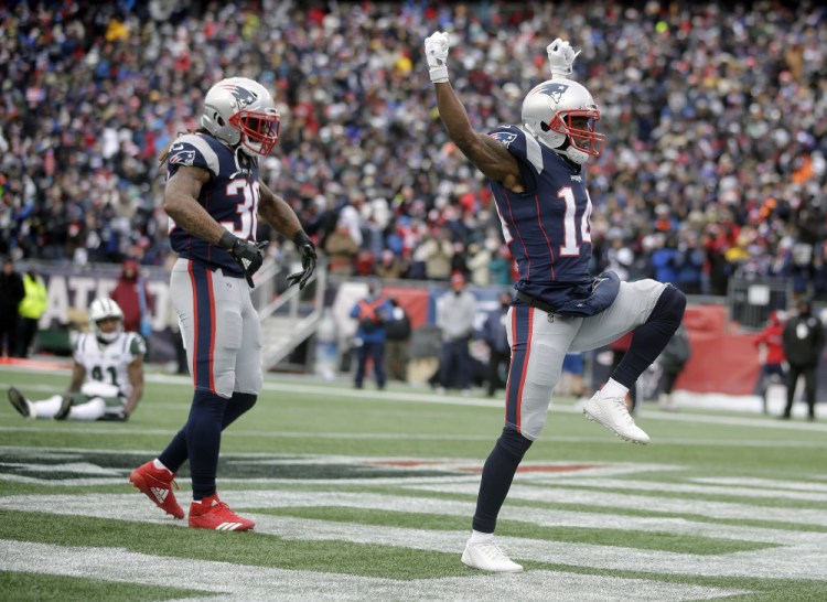 New England Patriots wide receiver Brandin Cooks, right, celebrates his touchdown catch in the second quarter of the Patriots' 26-6 win over the New York Jets on Sunday in Foxborough, Massachusetts. The Patriots secured home-field advantage in the AFC playoffs with the win.