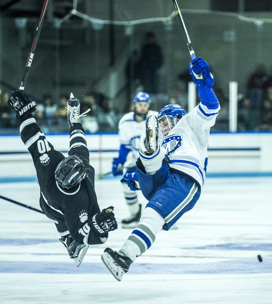 WATERVILLE, ME - DECEMBER 1, 2017 
 Colby College's JP Schulen (26) collides with Bowdoin College's Ronnie Lesten (10) at Alfond Ice Arena at Colby College in Waterville on Friday, Dec. 1, 2017. (Staff photo by Michael G. Seamans/Staff Photographer)