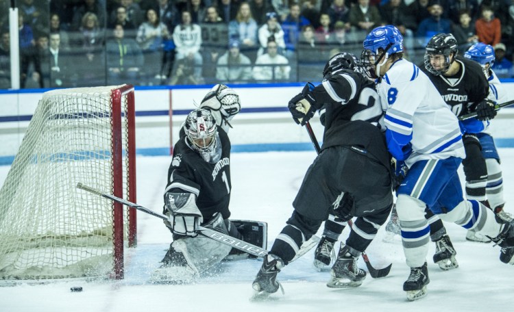 WATERVILLE, ME - DECEMBER 1, 2017 
 Bowdoin College goalie Alex Zafonte (1) makes a save as Colby College's Justin Grillo (8) looks for the rebound at Alfond Ice Arena at Colby College in Waterville on Friday, Dec. 1, 2017. (Staff photo by Michael G. Seamans/Staff Photographer)