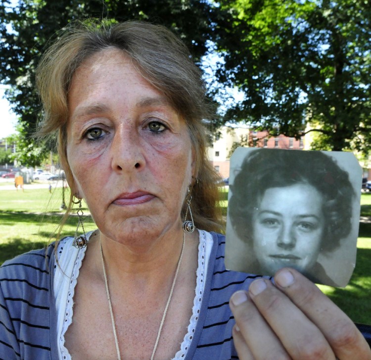 Honey Rourke of Lewiston, on July 26, holds a photograph of her mother, Pauline Rourke, taken in 1970. Pauline Rourke disappeared in 1976 and is believed to have been murdered by Albert Cochran who died in June in prison.