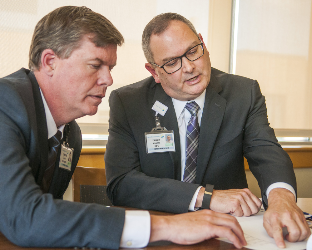 Chuck Hays, left, president and chief executive officer of MaineGeneral Medical Center in Augusta, says the hospital system has "a good plan" for the year ahead in addressing complaints from primary care physicians that has resulted in operating losses and a credit downgrade. The hospital's chief financial officer, Terry Brann, right, says he expects the losses in the first half of this year — $2.9 million — can be made up for in the second half, which is typically a busier time of year.