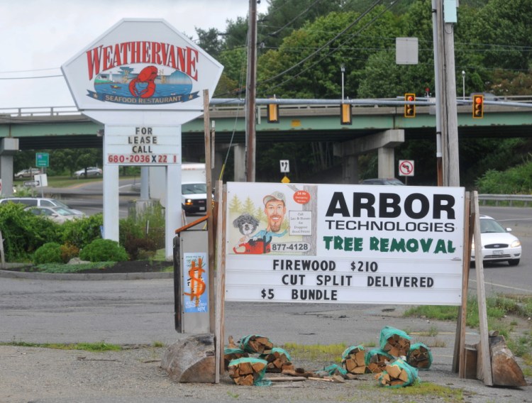 The Weathervane Restaurant and a former car wash and arborists building on Kennedy Memorial Drive are are seen in Augusta 2015 before they were torn down. A developer plans to build a new strip mall at the site, possibly next spring.