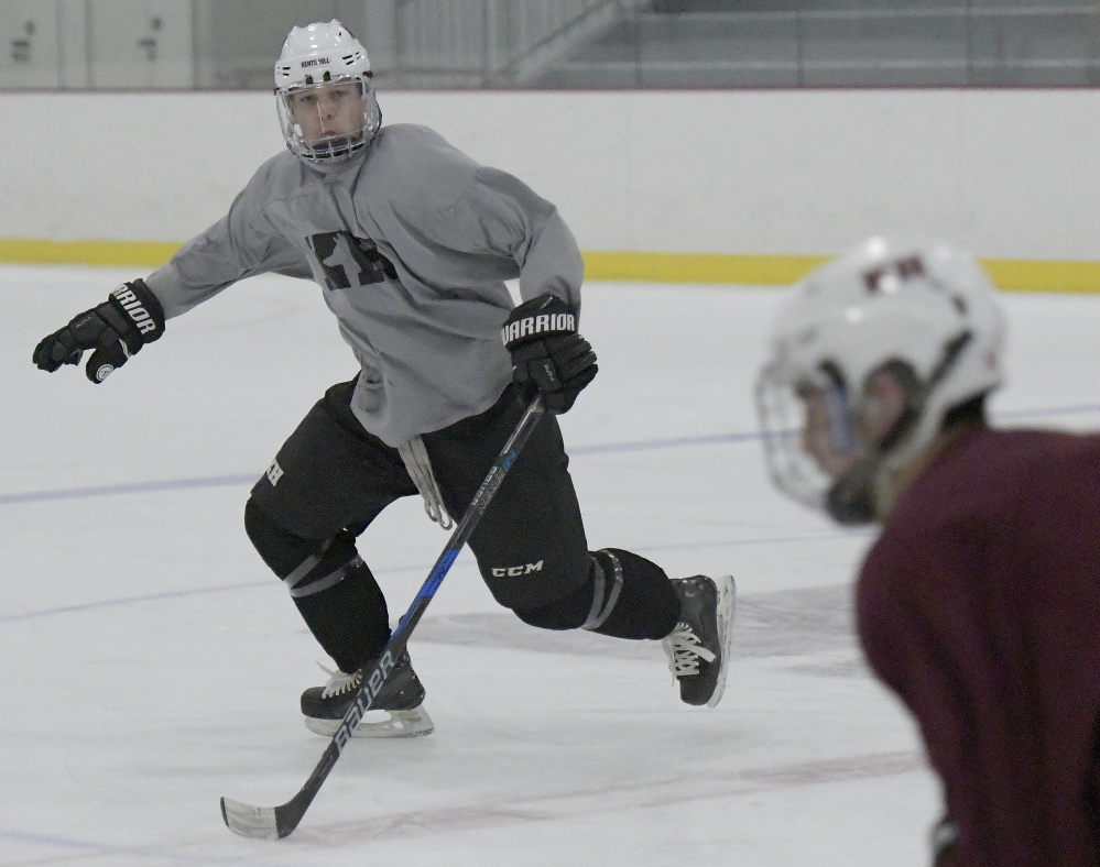 Jackson Aldrich, left, on the ice Tuesday during hockey practice at Kents Hill School in Readfield.