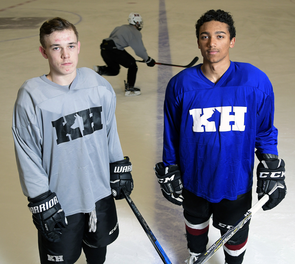 Jackson Aldrich, left, and Cam Wilson stand on the ice Tuesday during practice at Kents Hill School in Readfield.