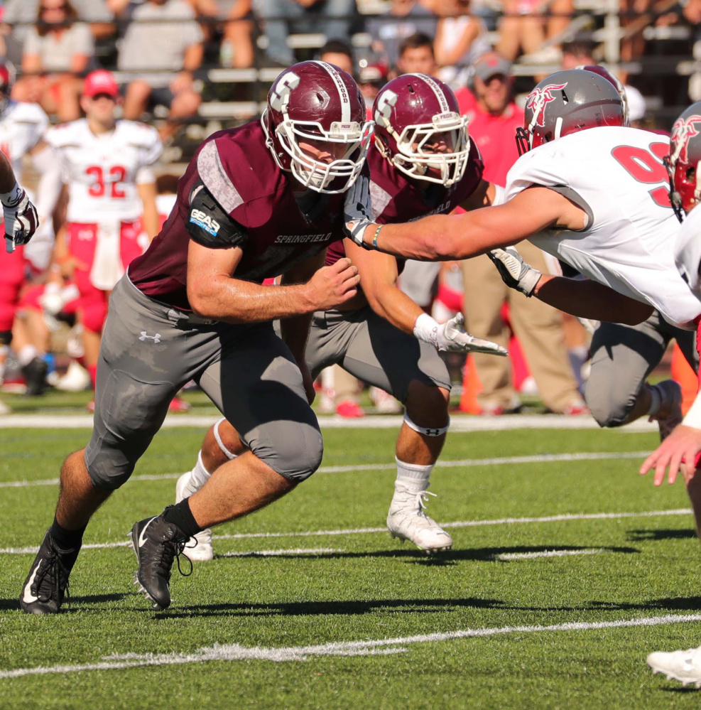Springfield College offensive lineman and Madison graduate Chris Hayden makes a block in a game earlier this season. The Pride led all of Division III football in rushing this year.