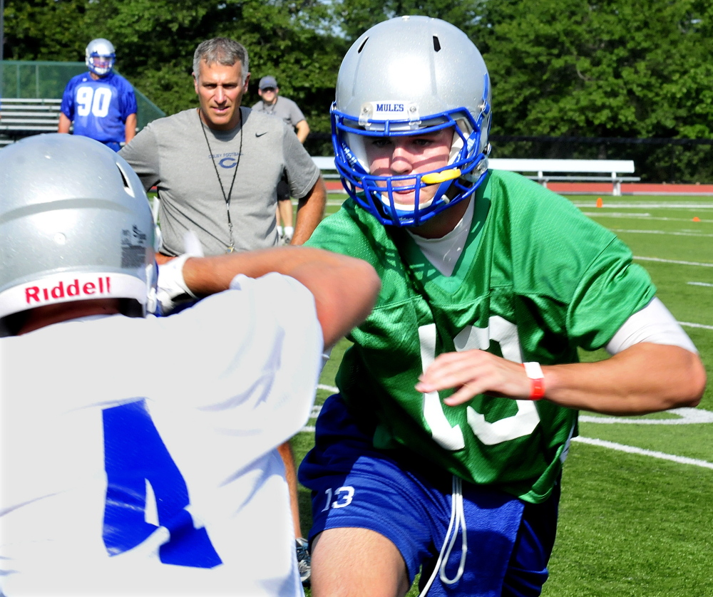 Colby College head football coach Jonathan Michaeles watches his team during a 2014 practice in Waterville.