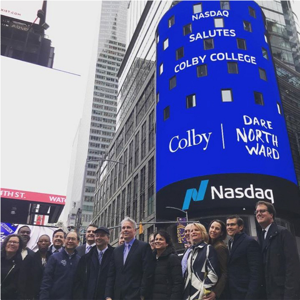 Thanks to a college trustee, Colby College leaders were invited to the Nasdaq stock exchange to witness the opening bell of Wednesday's session. Logos of Colby and Dare Northward, the name of the college's capital campaign, were projected on the Naasdaq sign in Times Square.