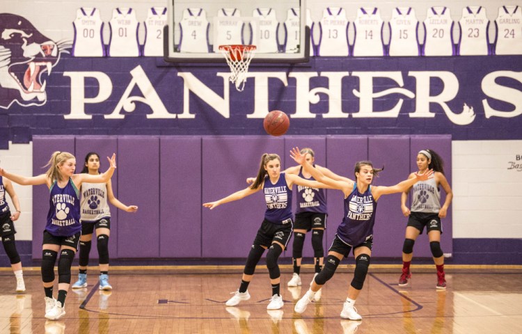Members of the Waterville girls basketball team practice Thursday at the school.