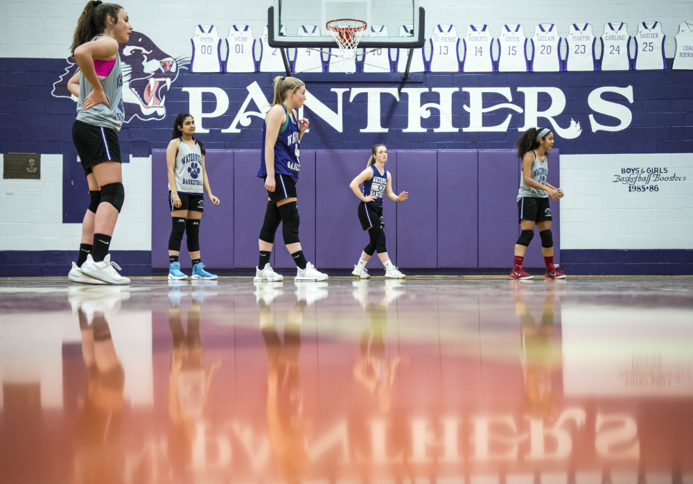 Members of the Waterville girls basketball team practice Thursday at the school.