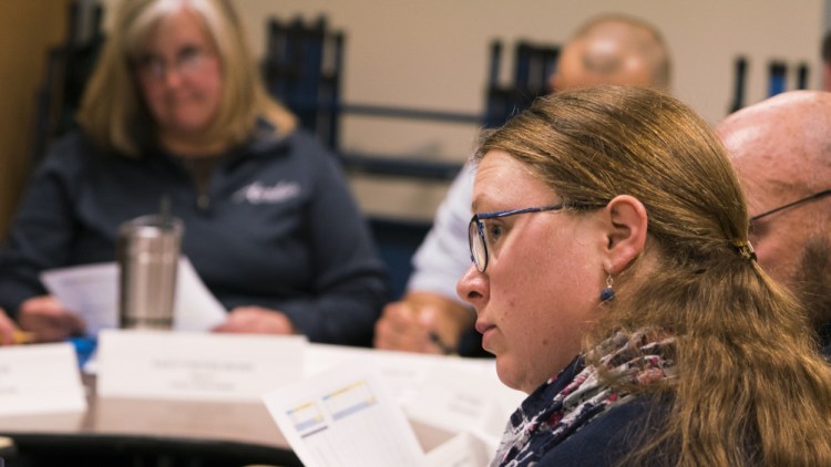 Sarah Bolduc-Ignasiak, left, a parent and member of the Future of the T.C. Hamlin Committee, listens in November to a discussion about options regarding the school now that enrollment has dropped to 44 students.