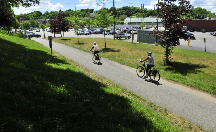 Bicyclists reach the end of the Kennebec River Rail Trail in the Hannaford parking lot in Gardiner in June 2016. There are plans to lengthen Gardiner's trail system by adding a stretch along Cobbossee stream, and city officials will review the latest designs for the proposed trail at a meeting Wednesday.