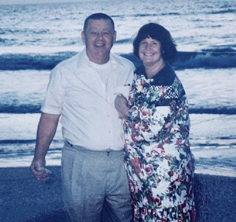 Clyde and Kim Shue are seen in an undated family photo. Police say that the married couple died in an apparent murder-suicide in their Manchester home on Saturday, with Clyde apparently shooting his wife and then himself.