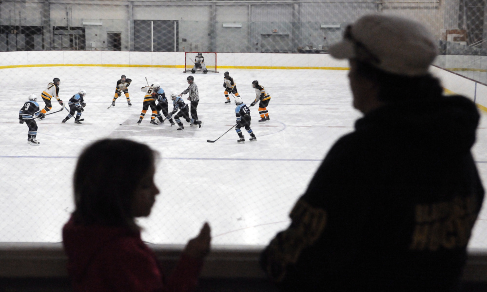 Spectators watch a Marnaook bantams youth hockey game against Presque Isle on Saturday morning at Bonnefond Ice Arena on the Kents Hill School campus.