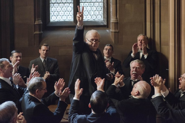 Gary Oldman, center, stars as Winston Churchill in director Joe Wright's "Darkest Hour," a Focus Features release.