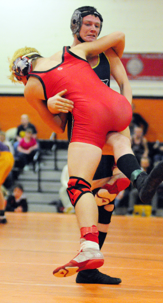 Cony's Jakob Arbour, left, and Mt. Blue's Hayden Nile compete in a 152- pound semifinal match during the annual Tiger Invitational lst Saturday in the James A. Bragoli Memorial Gym at Gardiner Area High School. Nile won the match. The wrestlers will compete in the annual Cony Duals this weekend.