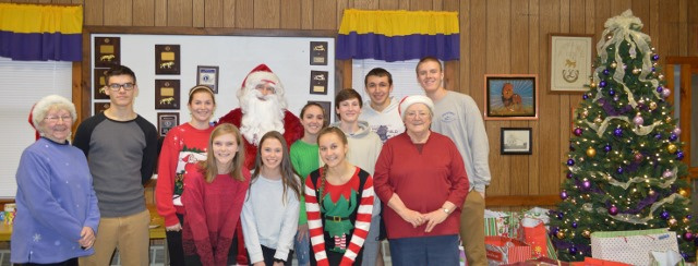 Whitefield Lions Club hosted its annual Christmas for Kids party Dec. 10. From left are Carolyn Greenwood, Caitlin Labbe, Dagan Savage, Lydia Gilman, Santa, Courtney Paine, Alana York, Olivia Kunesh, Alex Mahon, Harrison Mosher, Brenda Bonsant and Noah Bonsant.