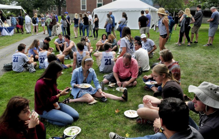 Colby College students and parents line up for lunch on the first day of freshmen arrivals on the Waterville campus on Aug. 29, 2017.