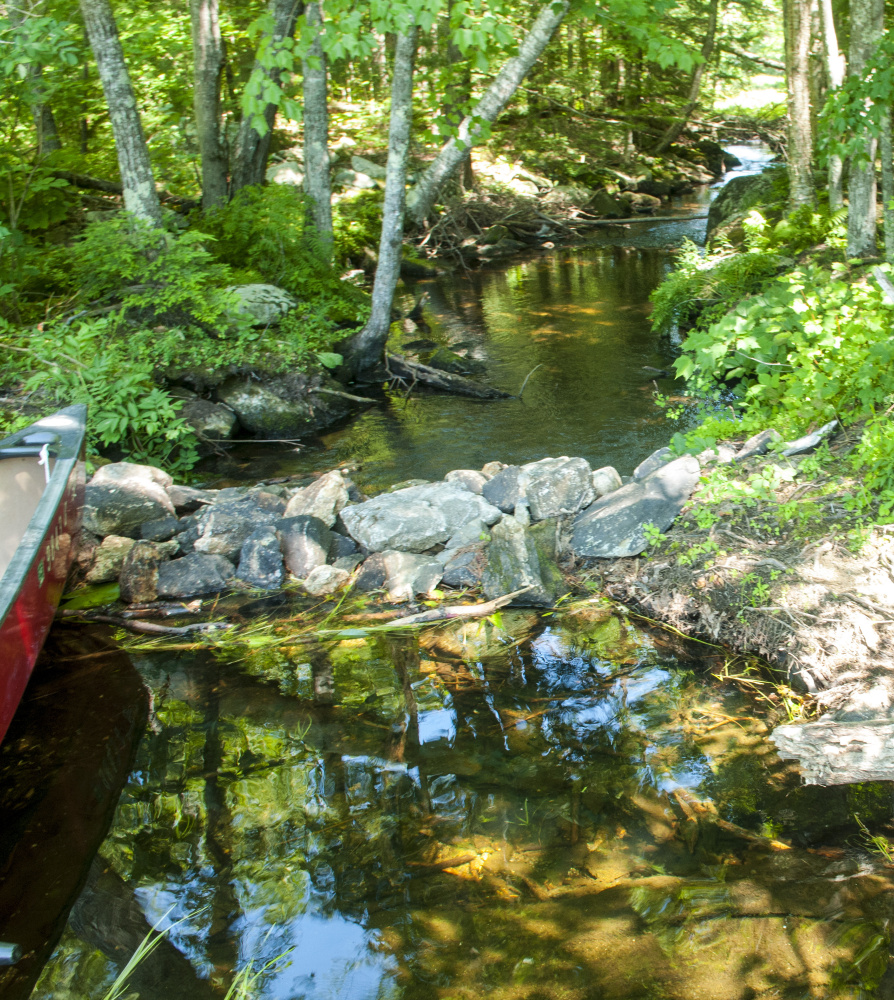 This rock impoundment holds back water Aug. 2 on David Pond in Chesterville.