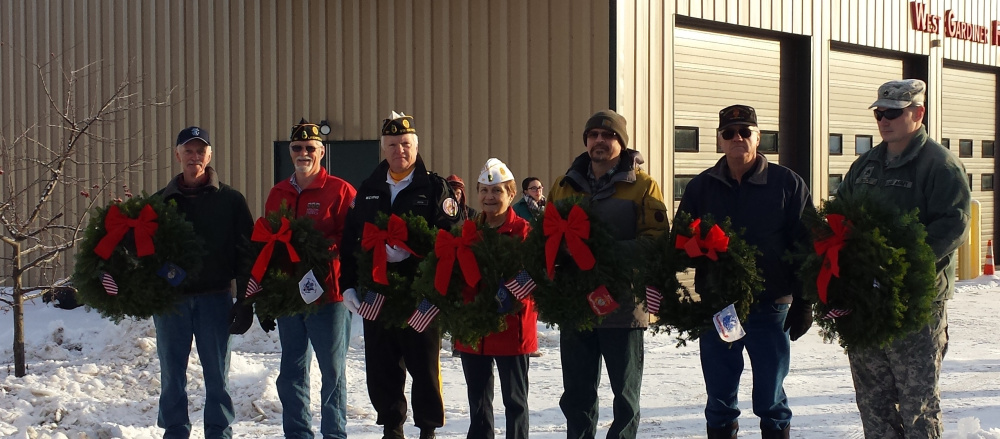 As part of the Wreaths Across America celebration, seven veterans from West Gardiner laid wreaths at the town's Veterans' Memorial on Dec. 16. The wreaths, with flags from all branches of the military services and POW/MIAs, were displayed. Ms. Bryce Smith sang the Star Spangled Banner and Dylan Haskell played Taps. From left are Dan McLaughlin, Greg Couture, Ron Dixon, Deb Couture, Keith Jiminez, Don Goggin and Sgt. 1st Class Michael Boyce.
