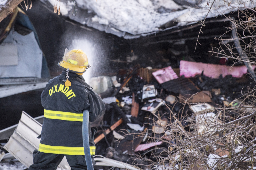 Firefighters from several fire departments battle a structure fire Wednesday on Moose Head Trail road in Plymouth.