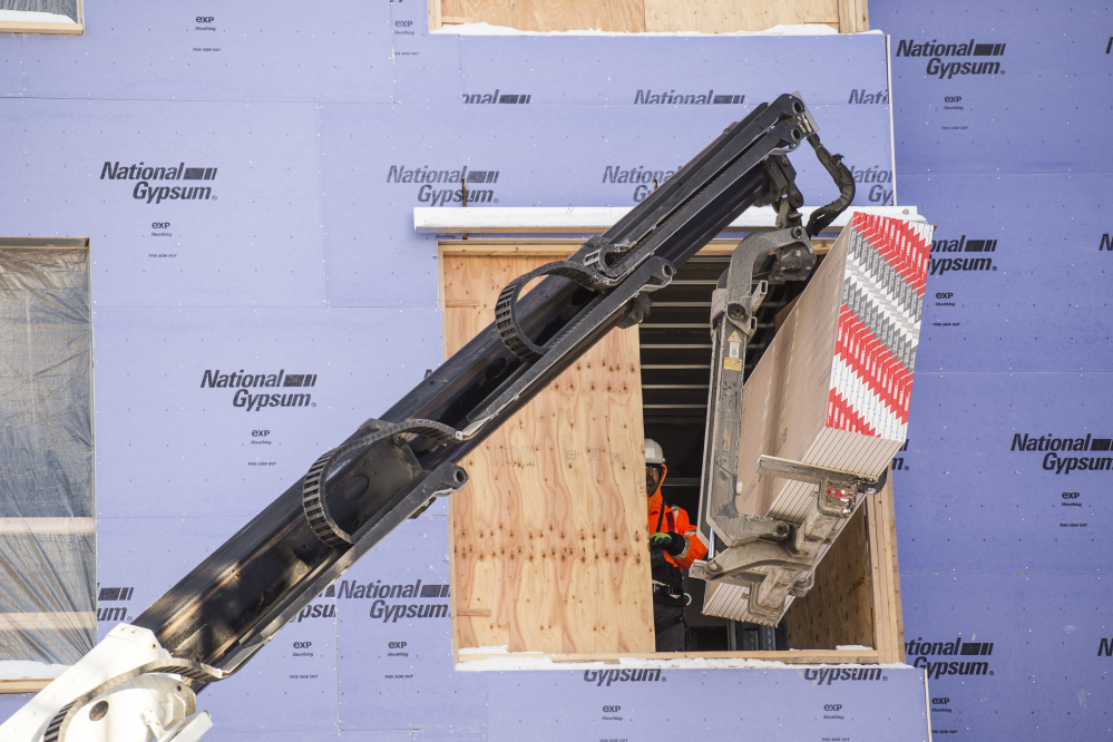 Despite deep freeze, work continues across central Maine