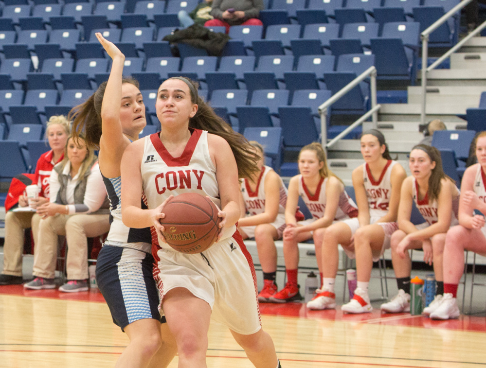 Cony's Sarah Caron looks for an open shot while being defended by Oceanside's Grace Woodman during the Capital City Hoop Classic on Friday at the Augusta Civic Center.