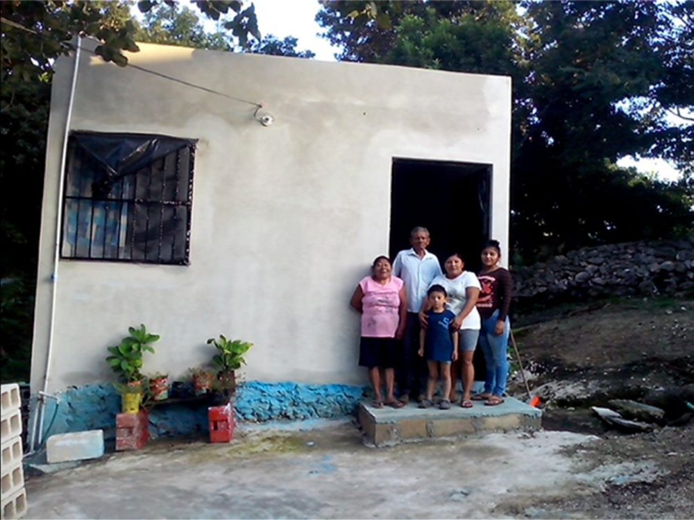 A Wayne couple has helped the family of Antonia Dzul, second from right, replace its dilapidated home in the Mexican city of Tizimin with the one seen here.