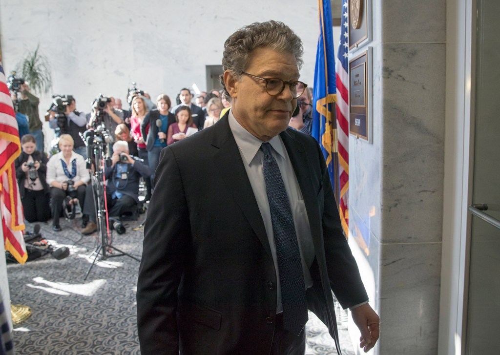 Sen. Al Franken, D-Minn., returns to his office after talking to the media on Capitol Hill on Monday. On Wednesday, multiple colleagues, many of them women, called on him to resign because of allegations of sexual impropriety.