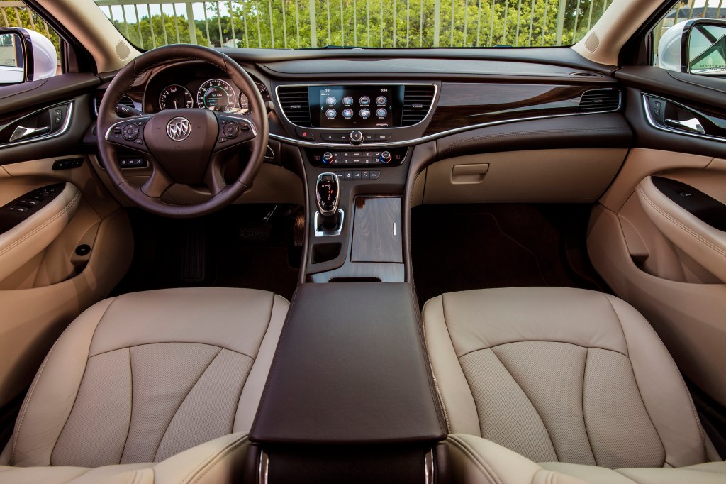 The 2018 Buick LaCrosse has ample knee and legroom, and when there is no third person riding in the back, a pull-down center armrest is available with dual cupholders. 