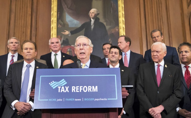 Senate Majority Leader Mitch McConnell, R-Ky., center, and Speaker of the House Paul Ryan, R-Wis., have reached an agreement in principle on a sweeping bill to change American tax law.