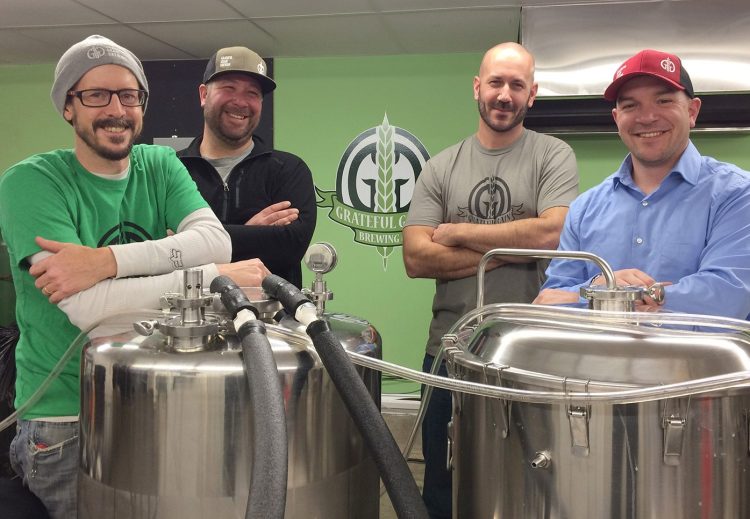 Business partners and friends, from left, Trevor Knell, Ryan Cote, Tom Langlois and Nick Knowlton opened Grateful Grain Brewing Co. in Monmouth this month. They sold out of beer in their first nine hours of business.
