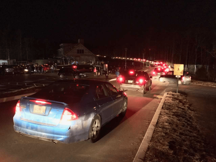 Cars leave the Coastal Maine Botanical Garden in Boothbay Sunday after the lights went out in its Gardens Aglow display. (Staff photo by Tux Turkel)