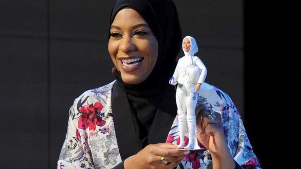 Olympic fencer Ibtihaj Muhammad shows the hijab-wearing Barbie modeled after her. (Twitter photo: Ibtihaj Muhammad @IbtihajMuhammad)