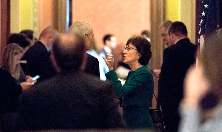 Sen. Susan Collins, R-Maine speaks with Sen. Rob Portman, R-Ohio, on Friday as Republican senators gathered to meet with Senate Majority Leader Mitch McConnell, R-Ky., on the effort to overhaul the tax code.