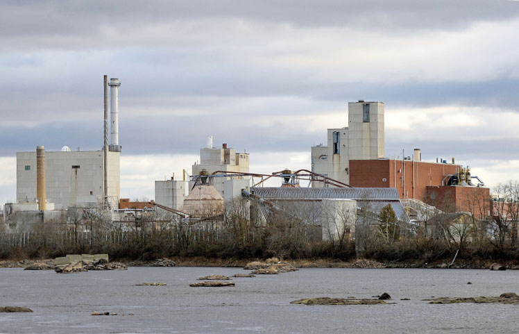 Of 16 companies applying to help the University of Maine use the former Old Town paper mill site, above, for generating wood-fired steam and electricity, New York-based ConEdison Solutions won an "award to negotiate." It was chosen partly because it would use the mill's biomass boiler. 