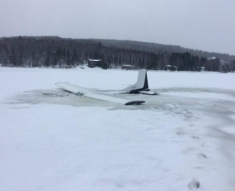 Warden Pilot Jeff Spencer's plane after hitting some thin ice while landing on Eagle Lake.