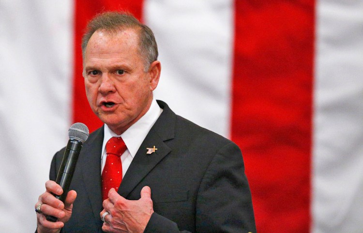 Roy Moore speaks at a campaign rally on Dec. 11.  Moore's attorneys say there was a higher than expected turnout for the election in Jefferson County, and Moore's numbers were suspiciously low in about 20 of the county precincts. 