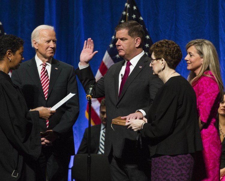 Former Vice President Joe Biden watches as Mayor Marty Walsh is inaugurated at the Cutler Majestic Theatre in Boston on Monday. "We are one of the greatest cities in the world and after nearly four centuries, our greatest days are yet to come," Walsh said.