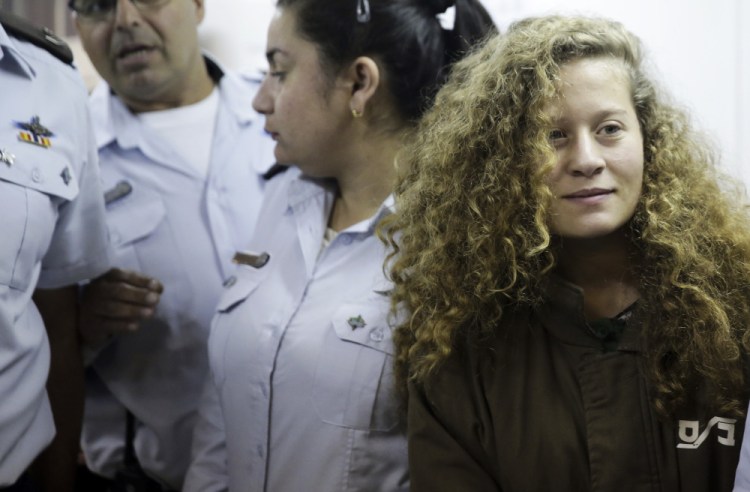 Ahed Tamimi is brought to a courtroom inside Ofer military prison near Jerusalem on Thursday. A military court indicted Tamimi, 16, on Monday for attacking Israeli soldiers as well as for previous altercations.